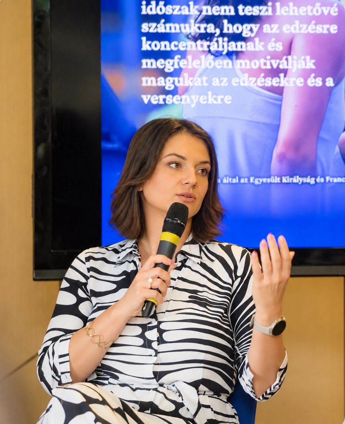 Zsófia Boros speaking at an event